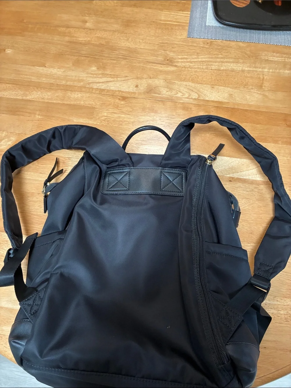 Tutilo Black Men's Backpack with Gold Zipper Accents